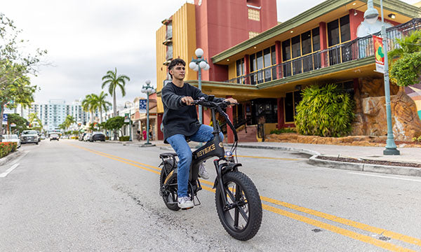a man is riding tyson fat tire ebike