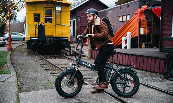 a man is riding Mars folding ebike