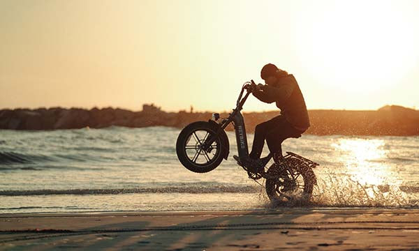 a man riding Ranger s ebike on the beach