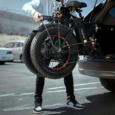 The folded electric Mars bicycle is put into the trunk