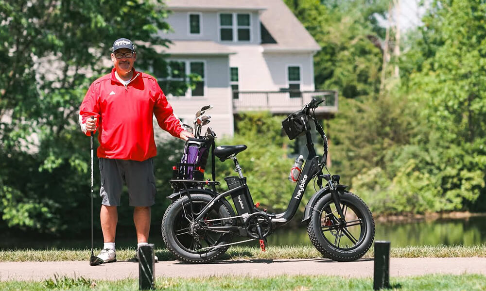 A man rides a Ranger fat tire e-bike to the golf playground.