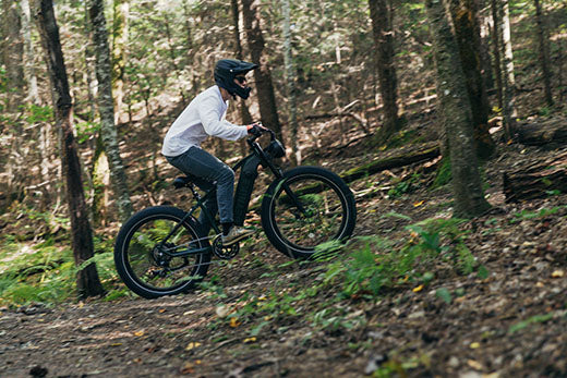 A man is riding heybike electric mountain bike on outside